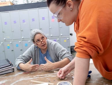 Professor helps a student in 3-Dimensional Design class.