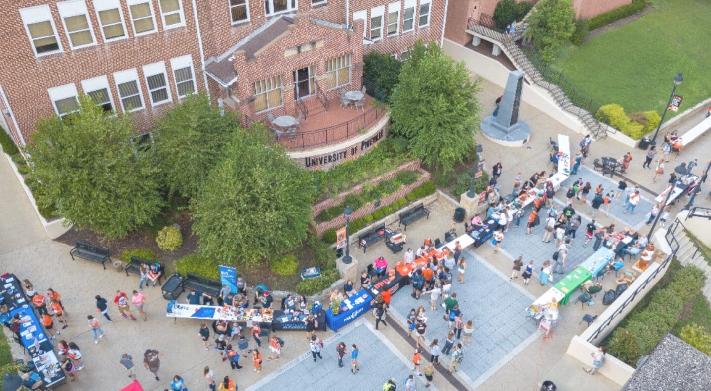 Aerial drone shot of benefactors plaza during the annual welcome week street fair