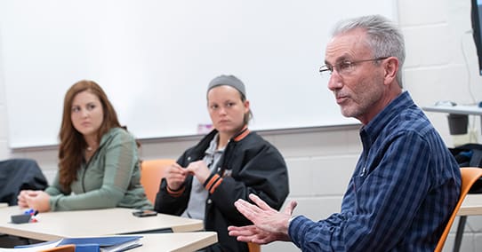 religion professor james browning talking to students