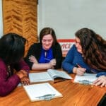 students studying and tutoring