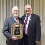 KYCOM Dean Dana Shaffer stands with Dr. Ed Stiles holding his award for John A. Strosnider Memorial Lecturer