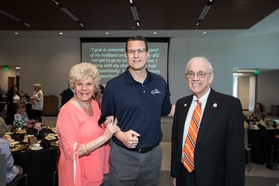 Paul and Judi Patton with UPIKE Athletic Director and Men's Basketball Head Coach Kelly Wells