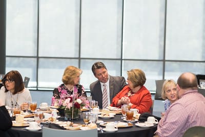 President Burton Webb visits with employee donors
