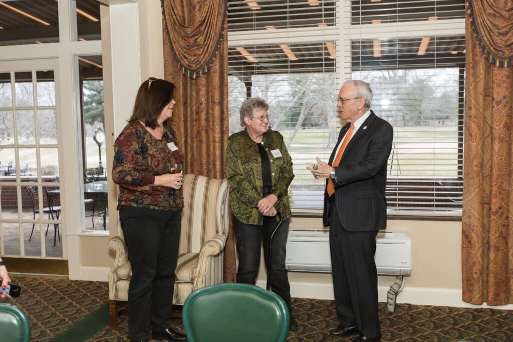 UPIKE Chancellor talking with guests