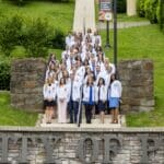 KYCO Class of 2021 pose in their symbolic white coats