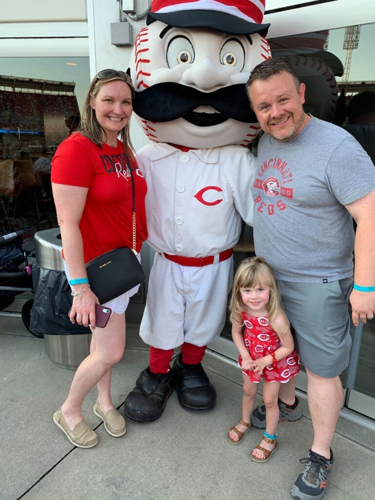 Family with Reds mascot