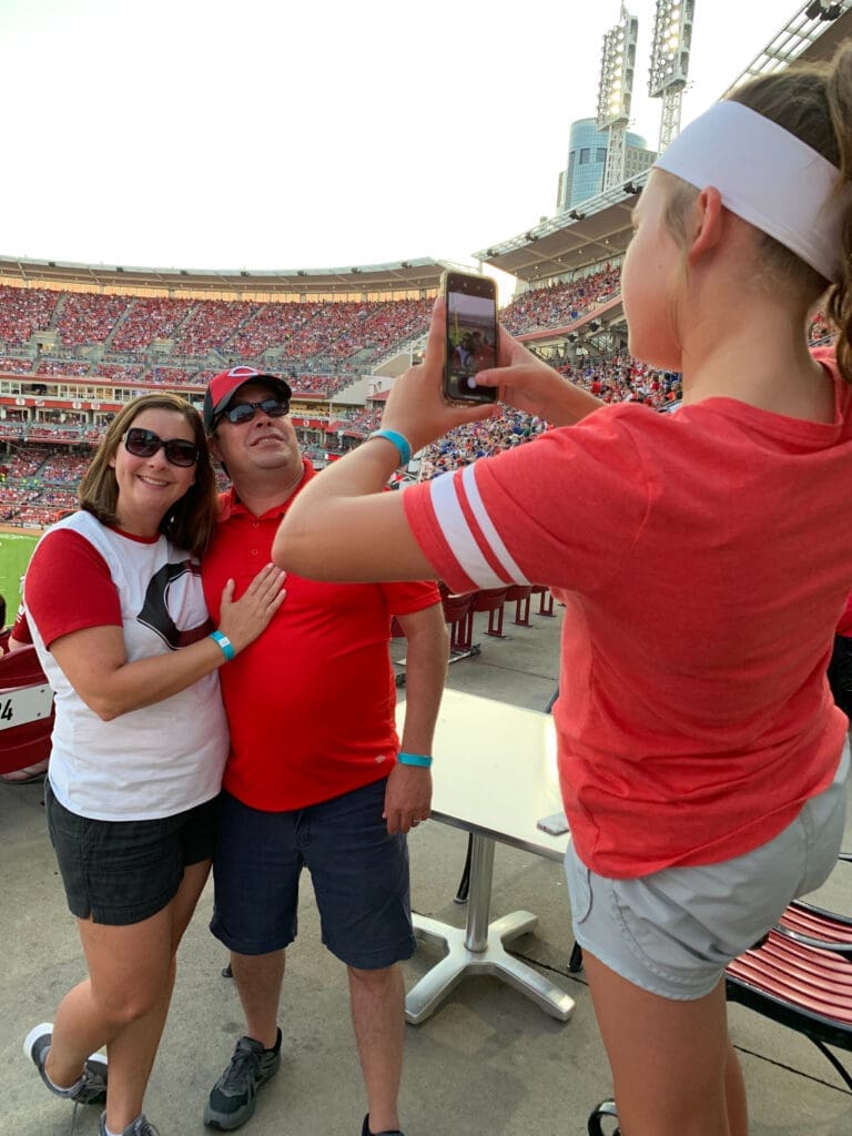 Family taking photo at ballpark