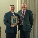 Steve R. Harris recieves the award from Dana Shaffer, KYCOM dean