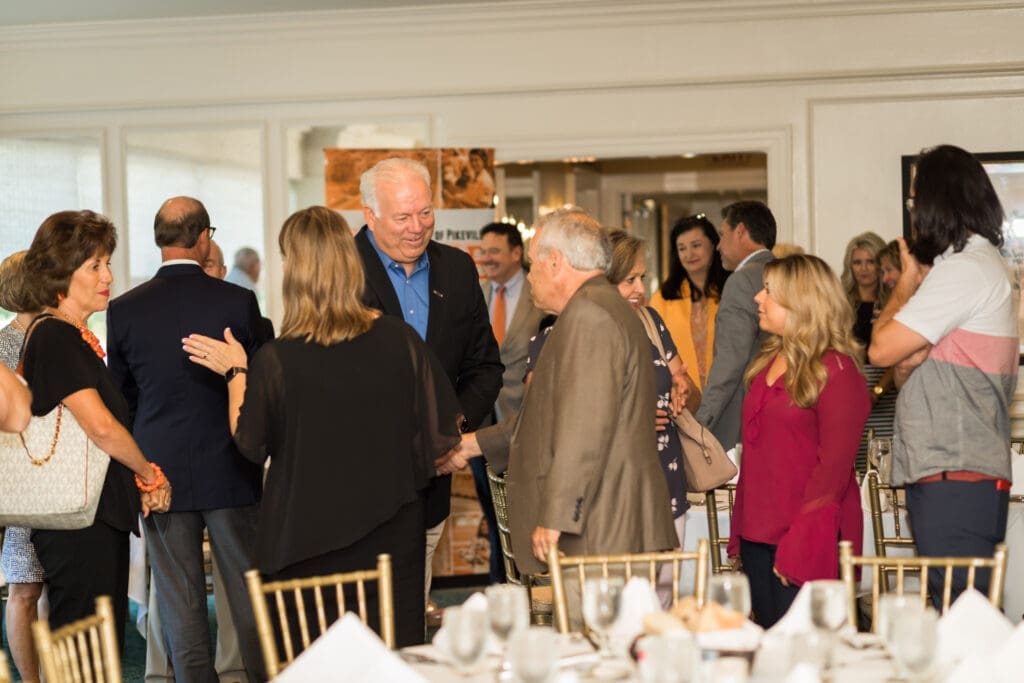 group of guests greeting one another during the event