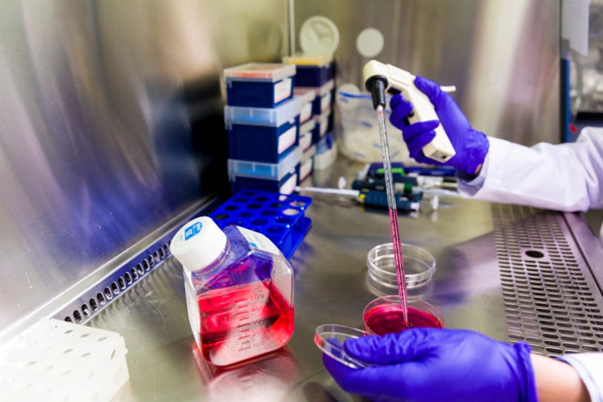 student doing lab work in research lab