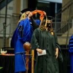 MSW graduate being hooded by UPIKE faculty