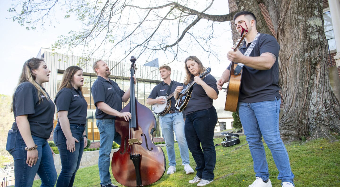 Bluegrass band playing in the grass near the plaza