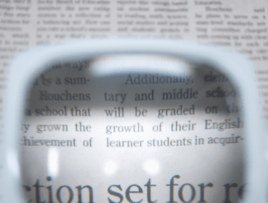 low vision tool on newspaper