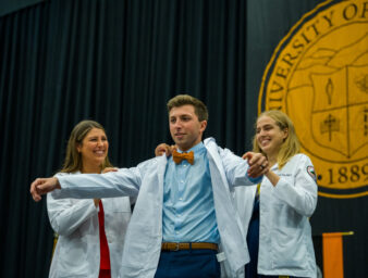 KYCOM student receiving White Coat