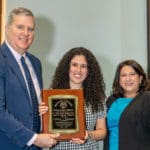 Dean of KYCO Dr. Bacigalupi and his wife award KYCO graduate Colette Houssan '23