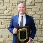 Dr. Jody Johnson with Founders Dinner plaque