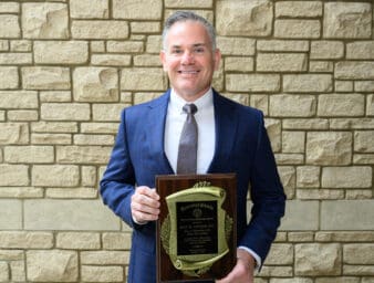 Dr. Jody Johnson with Founders Dinner plaque