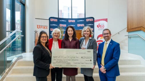 Professor Han accepts check from AHA representatives.