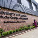 Three KYCO students walking by the HPE Building