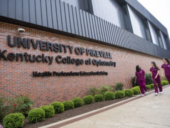 Three KYCO students walking by the HPE Building