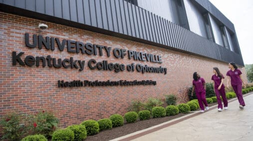 Three KYCO students walking by the HPE Building