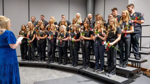 Nursing graduates reciting the Florence Nightingale Pledge.