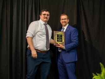 Luke T. Adkinson, D.O., accepts the Stephen M. Payson, M.S., Memorial Scholarship Award, presented by Dean of the Kentucky College of Osteopathic Medicine, Joe Kingery, D.O., MBA, FACOFP, FAAFP.