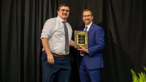 Luke T. Adkinson, D.O., accepts the Stephen M. Payson, M.S., Memorial Scholarship Award, presented by Dean of the Kentucky College of Osteopathic Medicine, Joe Kingery, D.O., MBA, FACOFP, FAAFP.
