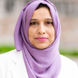 Dr. Saima Ejaz headshot taken outside on a sunny morning