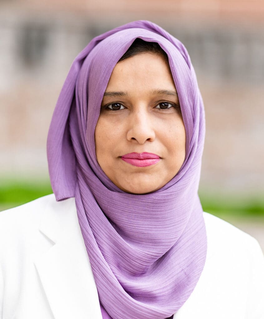 Dr. Saima Ejaz headshot taken outside on a sunny morning