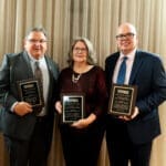 Inductees together with their plaques