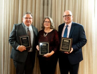 Inductees together with their plaques