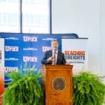 President Burton Webb at the podium