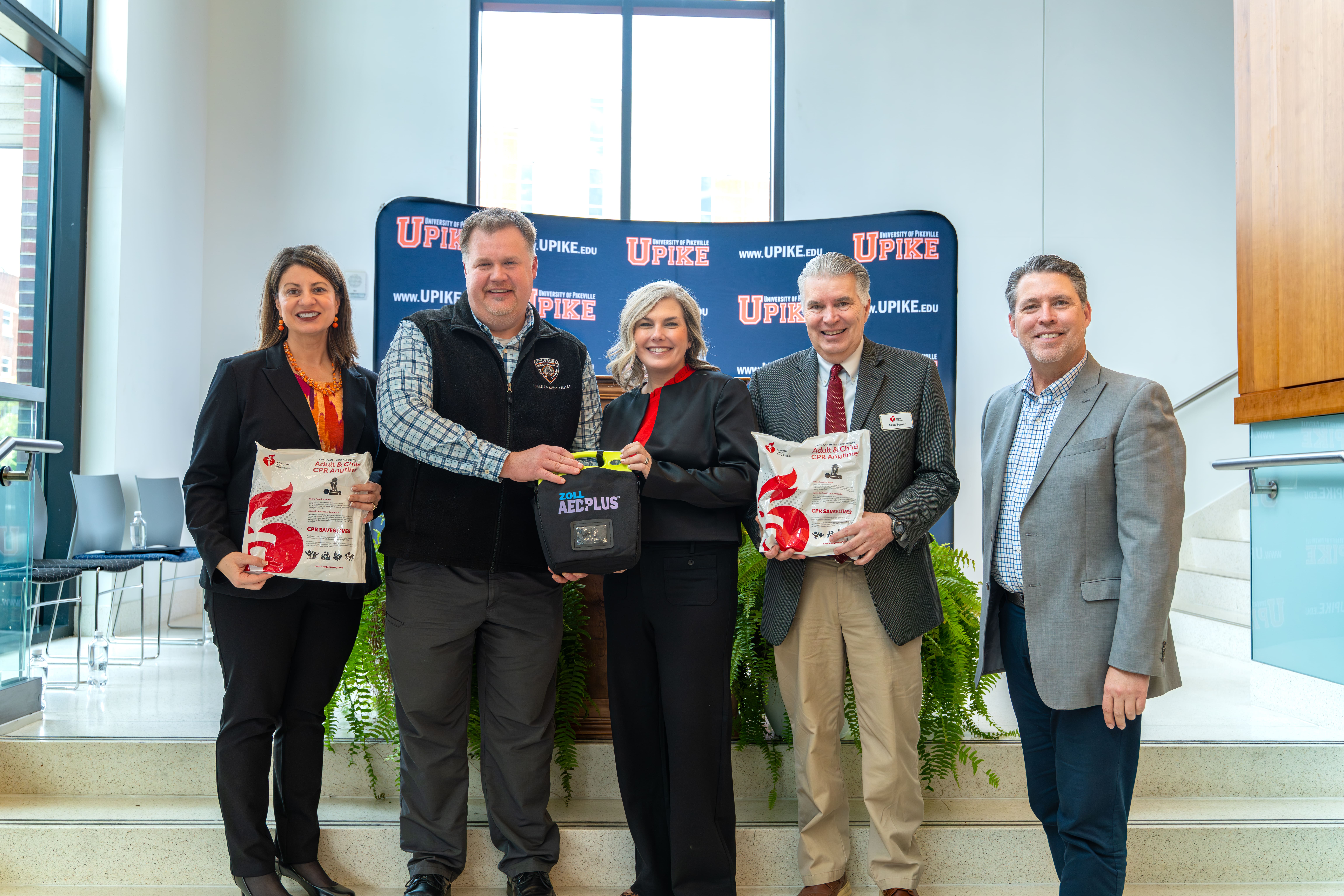 Pictured from left to right: Executive Vice President and Chief Strategy Officer of the University of Pikeville, Lori Werth, Ph.D.; Director of UPIKE Public Safety, Lee Upchurch; Executive Director of the American Heart Association in Central and Eastern Kentucky, Andrea Ooten; Community Impact Director of the American Heart Association in Central and Eastern Kentucky, Mike Turner; and President of the University of Pikeville, Burton Webb, Ph.D.