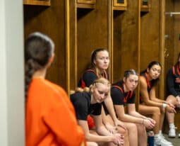 Players sitting on locker room
