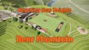 An aerial 3D rendering of UPIKE's Bear Mountain Sports Complex. A turf field sits on top of a mountaoin over looking Pikeville.