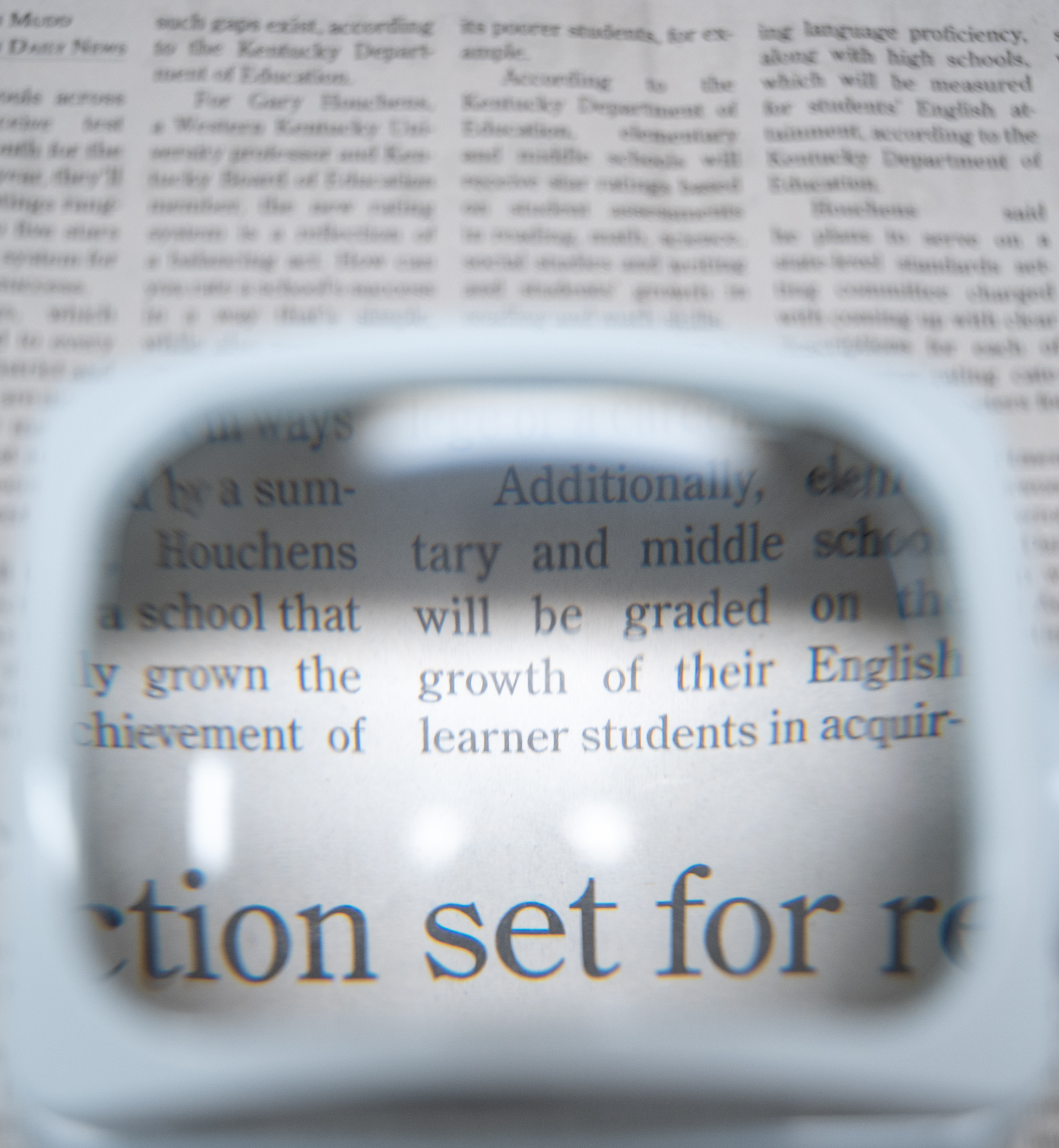 low vision tool on newspaper